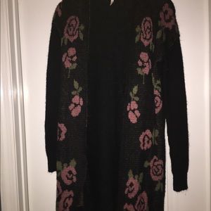 Black and red roses on a sweater by Frenchi